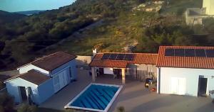 a house with solar panels on the roofs at House with pool in Mali Lošinj