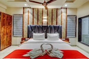 Ένα ή περισσότερα κρεβάτια σε δωμάτιο στο Hotel Apratim Lodging & Boarding