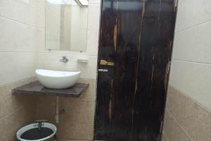 Ένα μπάνιο στο Hotel Apratim Lodging & Boarding