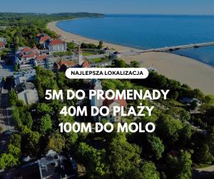 a picture of a beach with the words km do thermally do play at SeaSide Sopot - butikowe noclegi przy plaży in Sopot