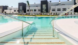 The swimming pool at or close to 208 New luxury apartment Calaserena