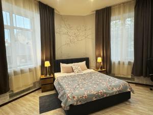 Una cama o camas en una habitación de SIGNEEV'S Villa