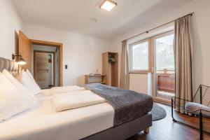 Postel nebo postele na pokoji v ubytování Gasthof Pension Knapp