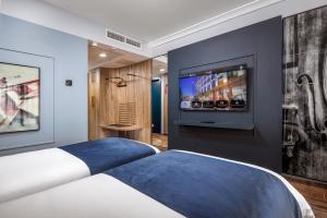 Vivaldi Hotel客房内的一张或多张床位