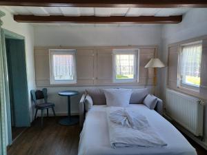 Postel nebo postele na pokoji v ubytování Hotel Zittauer Hütte