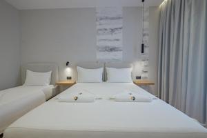 Postel nebo postele na pokoji v ubytování Hotel Kroi