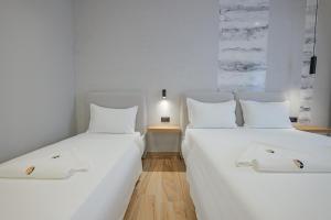 Postel nebo postele na pokoji v ubytování Hotel Kroi