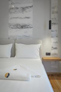 Postel nebo postele na pokoji v ubytování Hotel Kroi