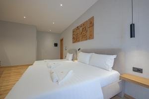 Postel nebo postele na pokoji v ubytování Hotel Kroi
