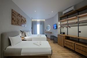 Postel nebo postele na pokoji v ubytování Hotel Kroi