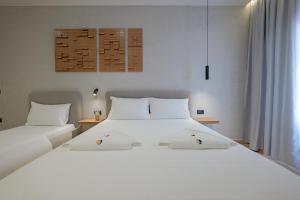 Postel nebo postele na pokoji v ubytování Hotel Kroi
