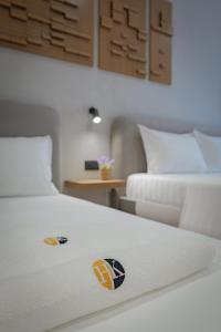 Postel nebo postele na pokoji v ubytování Hotel Kroi