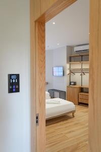 Postel nebo postele na pokoji v ubytování Hotel Kroi