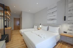 Postel nebo postele na pokoji v ubytování Hotel Kroi