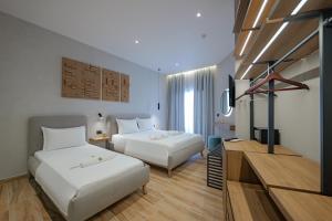 Postel nebo postele na pokoji v ubytování Hotel Kroi