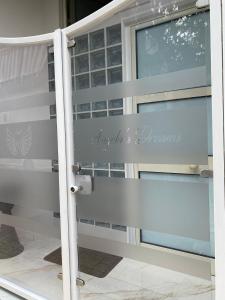 a sliding glass door with a sign that reads hyannis promise at Angela's dreams in Conversano