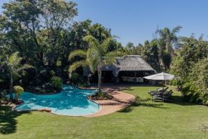 an aerial view of a resort with a swimming pool at The Wesley Boutique Hotel & Spa in Johannesburg