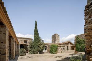 a view of the monastery from the courtyard at Castell de Vallgornera in Girona