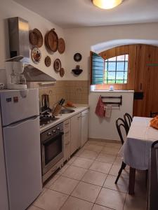 Kuchyň nebo kuchyňský kout v ubytování Guest House Lucijo