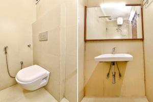 La salle de bains est pourvue de toilettes et d'un lavabo. dans l'établissement FabExpress Central Plaza, à Dehradun