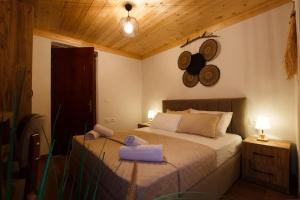 Postel nebo postele na pokoji v ubytování Guva Guest House