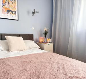 Posteľ alebo postele v izbe v ubytovaní Przytulny apartament 5 minut od morza