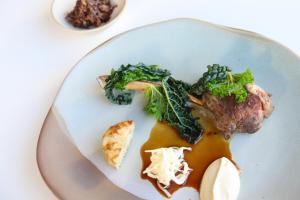 a white plate with food on a table at Housel Bay Hotel in Lizard