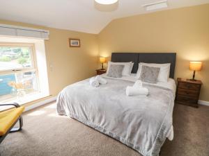 Postel nebo postele na pokoji v ubytování The Cottage Bradwell