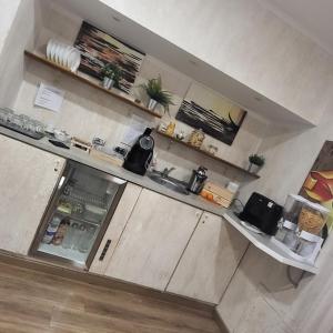 an overhead view of a kitchen with an open refrigerator at ILLUVIA 2 AFFITTA CAMERE in Cornaredo