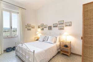 Ένα ή περισσότερα κρεβάτια σε δωμάτιο στο La Villa by Masseria San Nicola Savelletri +31 φωτογραφίες