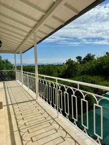 a view from the balcony of a house at Captain Christos Family Garden House in Lefkimmi