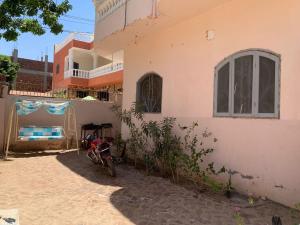 a motorcycle parked in front of a house at Villa Elhag Nile View in Luxor