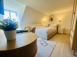 Postel nebo postele na pokoji v ubytování Lexow - Hotel an de Havenkant