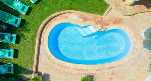 an overhead view of a swimming pool with grass at Villa Dreams by Algarve Vacation in Guia