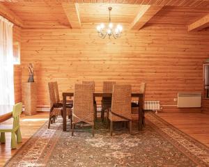 a dining room with a table and chairs at BOROVOE Country Club in Borovoye