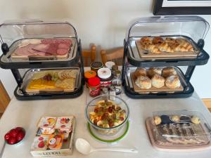 a counter with three trays of food on it at Slieve League House B&B in Teelin