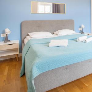 Llit o llits en una habitació de Smart Old Town Apartment