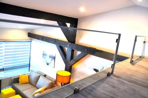 a living room with a couch and a loft at Feichten Glück 16 in Siegsdorf
