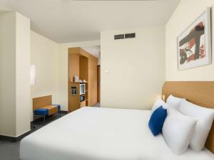 Postel nebo postele na pokoji v ubytování Novotel Budapest Danube