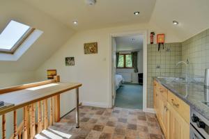 a kitchen with a sink and a counter top at Dunkery View in Minehead