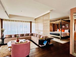 a living room with a couch and a bed at The Park Hyderabad, Banjara Hills near Hussain Sagar Lake in Hyderabad +153 photos