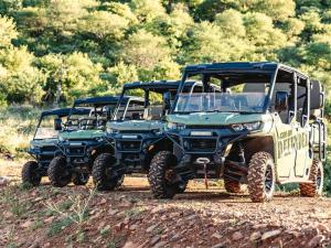 two green atvs parked on a dirt road at Thaba eNtle Private Boutique Game Farm in Thabazimbi