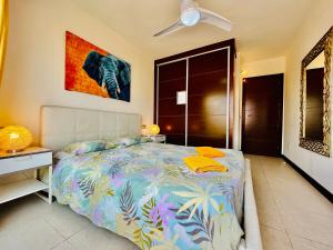 a bedroom with a bed and a painting on the wall at El Horno in Adeje +51 photos