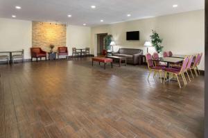 a waiting room with a table and chairs at Days Inn by Wyndham Pottstown in Pottstown