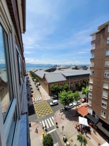 a view of a city street from a window at Nuevo! Pisazo en el centro para 8 personas in Santander