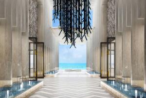 a lobby with a view of the ocean at Wyndham Grand Barbados Sam Lords Castle All Inclusive Resort in Saint Philip