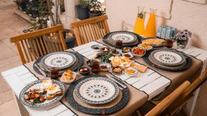 a table with plates of food on it at alba otel in Ildır