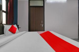 Krevet ili kreveti u jedinici u okviru objekta OYO Flagship Hotel Elite Inn