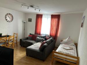 a living room with a couch and a table at Wohnung VS in Villingen-Schwenningen