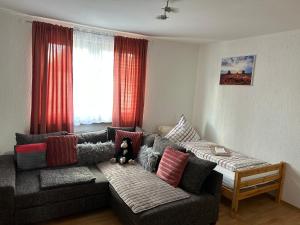 a living room with a couch and a window at Wohnung VS in Villingen-Schwenningen